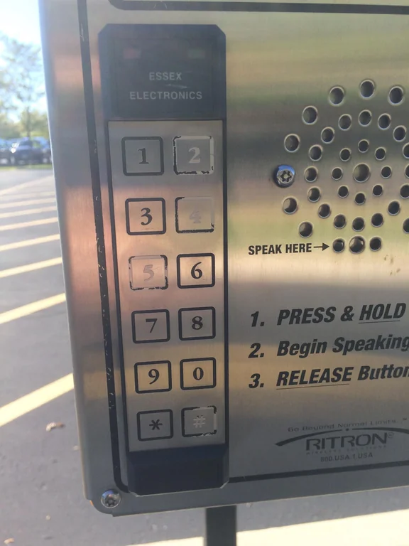 Keypad with digits 1, 7, 9, 0 partially erased.