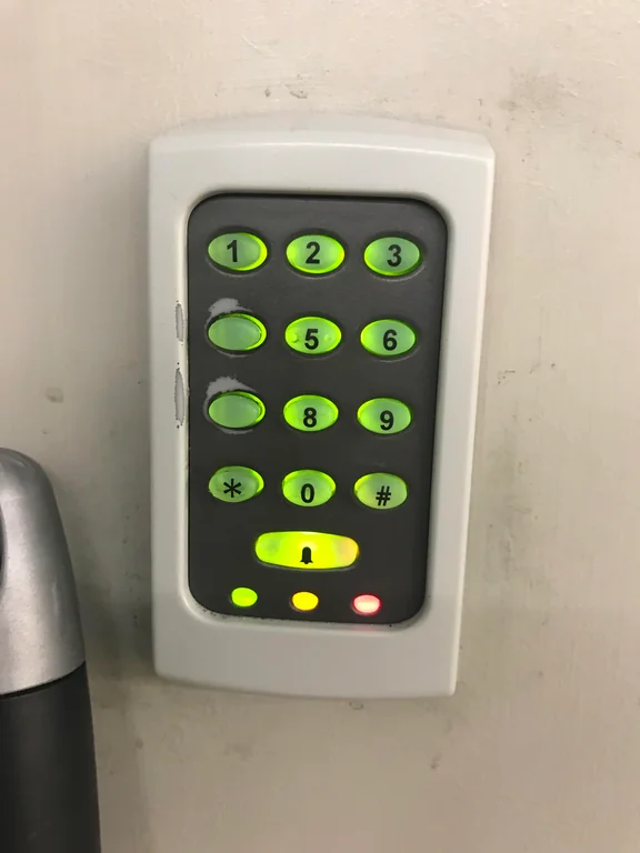 Keypad with digits 4 and 7 erased.